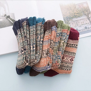 Five pairs of vintage winter wool socks for men with colorful ethnic patterns in soft knit