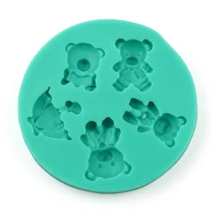 Detail of mint green silicone mold with five various cartoon bear shapes for DIY baking