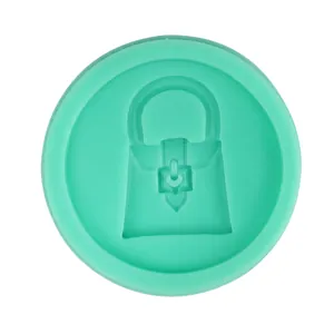 Detailed top view of green silicone mold featuring a classic luxury handbag shape