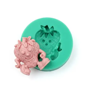 Detail of green olive leaf silicone mold with a pink fondant cartoon character