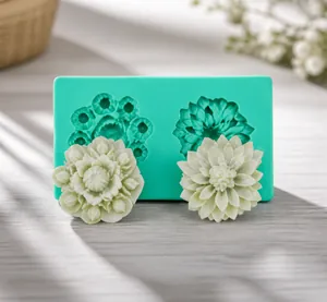 Detail showing blue silicone flower mold with white petal fondant replicas