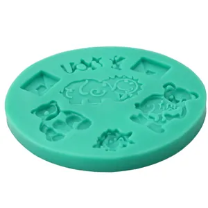 Detail view of round silicone mold with bear and geometric shapes in mint green