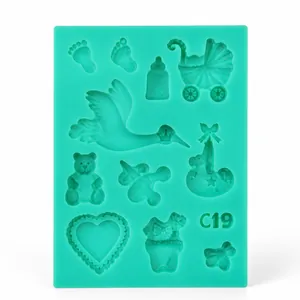 Detail of mint green silicone mold featuring baby shower patterns like stroller and bottle