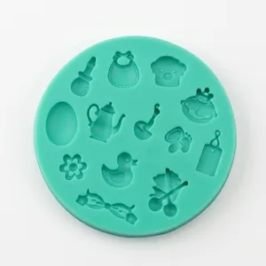 Detail view of round silicone mold with mini duck, cherry, and baby carriage patterns