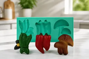 Detailed view of green silicone mold for mushroom and vegetable shaped fondant creations