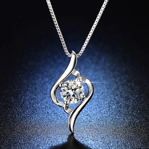 Detailed macro view of 1-carat moissanite necklace with spiral vortex pendant and box chain