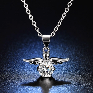 Close-up of sparkling 1 carat round cut moissanite pendant with silver angel wings detail