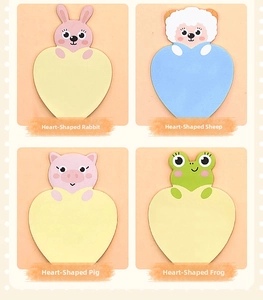 Detail view of heart-shaped cartoon animal sticky notes in rabbit sheep pig and frog styles