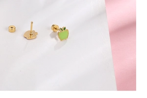 Detail of apple-shaped earrings with green enamel and secure screw-back posts