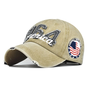 Detail of MAGA America embroidery and distressed ripped brim on washed cotton baseball cap