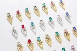 Macro detail of geometric 3D nail art charms with colorful alloy rhinestones