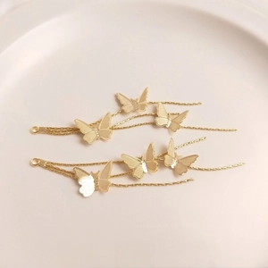 Detail of 14K gold plated butterfly tassel charms for DIY earring and jewelry making
