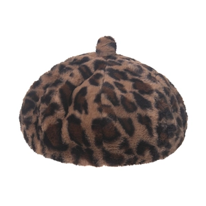 Close-up of leopard print plush beret hat showing soft faux fur texture and pattern