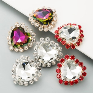 Detailed view of heart-shaped rhinestone jewelry charms in red, clear, and aurora colors