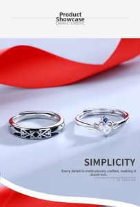 Detailed macro of silver couple rings set with crown design and heart zircon