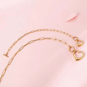 Golden paperclip chain necklace set with hollow heart pendant and toggle clasp closure
