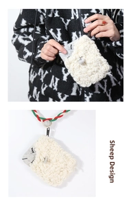 Detail of handmade crochet sheep coin purse with cute embroidery and woven colorful lanyard