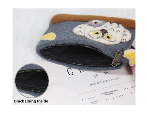 Detail shot showing the black lining and metal zipper of the owl wool felt coin purse