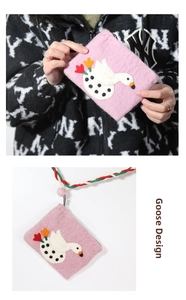 Close-up of pink handmade wool felt coin purse with cute goose and tulip embroidery