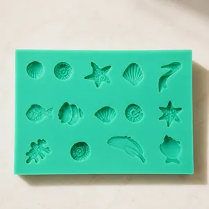 Detailed macro view of 15-cavity green silicone sea creature mold with starfish and shells