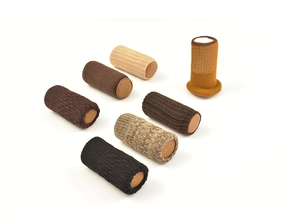 Detailed view of six multi-colored knitted chair leg floor protectors with felt bottoms