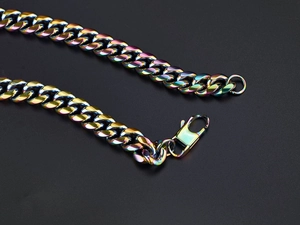 Macro shot of rainbow-colored hip hop Cuban link necklace with polished lobster clasp