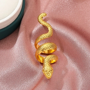Long punk snake-shaped ring in gold finish with textured scales on pink satin