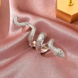 Detailed close-up of a silver snake ring featuring a spiral wrap design on silk