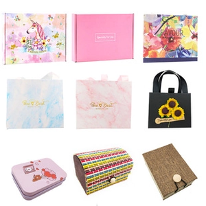 Collage of diverse gift boxes and bags featuring floral, marble and unicorn patterns