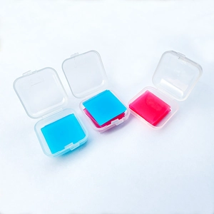 Detailed view of pink and blue square wax clay storage cases for diamond painting kits