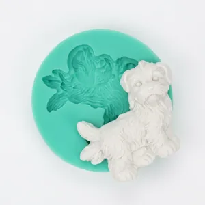Detailed mint green silicone mold with a finished 3D dog-shaped fondant figure