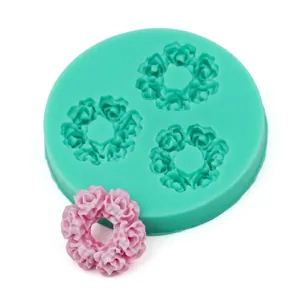 Green silicone mold showing detailed flower cluster patterns for cake decorating and soap