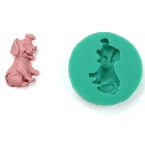 Detail of bird butterfly silicone mold and finished pink pig fondant cake decoration