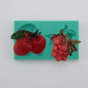 Detailed silicone mold showing cherry and grape shapes with colorful fruit fondant samples