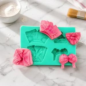 Silicone fondant mold with dress and bow shapes for cake decorating and DIY baking craft
