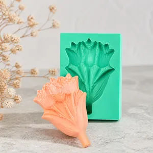 Detailed view of tulip flower silicone mold with finished orange soap craft model