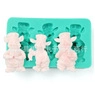 Macro detail of a 3-cavity green silicone sunflower cake mold with pink cartoon animals