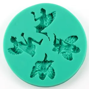 Top view of a round green silicone mold with four fairy patterns for DIY fondant baking