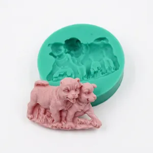 Detail of green silicone mold and pink resin dogs for DIY handmade crafts