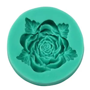 Macro detail of teal silicone rose flower mold with leaf texture for cake decorating