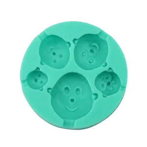 Detailed top view of a green 4-hole cartoon baby face silicone mold for baking DIY crafts