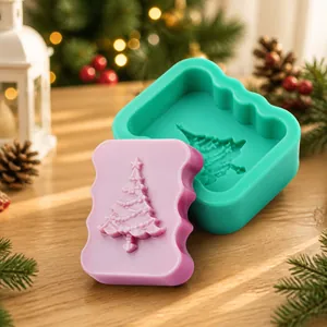 Detail of green silicone mold featuring embossed Christmas tree pattern for fondant DIY