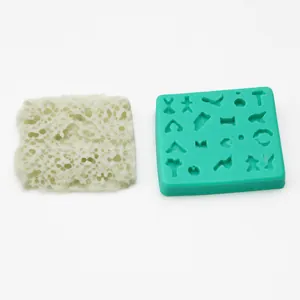 Detail of 2-piece silicone fondant molds with diverse miniature animal and human shapes