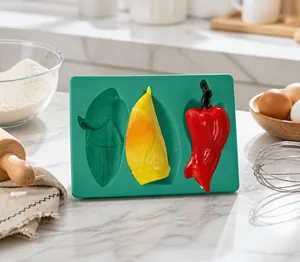Detail of green silicone mold featuring bamboo shoots and chili peppers for DIY baking