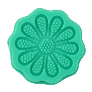 Close-up of a green 8-petal flower silicone mold with textured center for baking cake