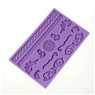 Macro detail of purple silicone mold showing embossed floral and rope patterns for baking