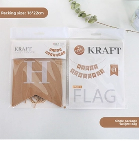 Flat lay of Happy Birthday kraft paper banner sets with eucalyptus decor for party
