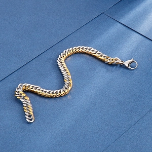 Men's two-tone gold and silver chunky curb link bracelet with a lobster clasp