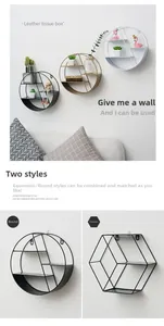 Close-up of geometric iron wall shelf showing multi-layer metal grids and black finish