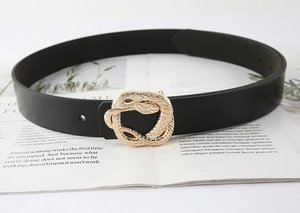 Detailed view of black leather belt featuring an intricate gold snake-shaped metal buckle